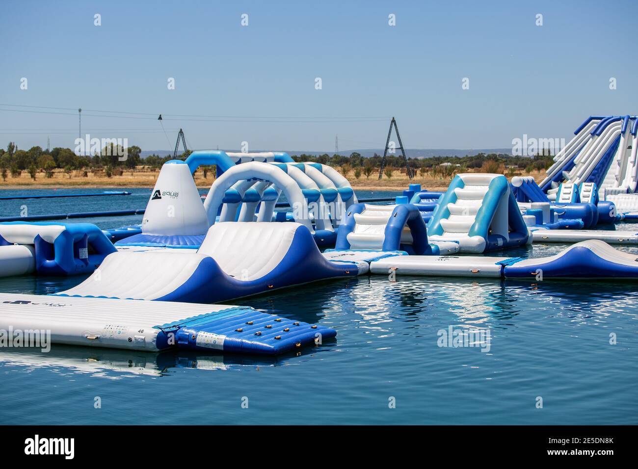Perth, Australia - January 22nd 2021: Perth Aqua Park, a huge floating inflatable fun park with over 100 interconnected obstacles Stock Photo
