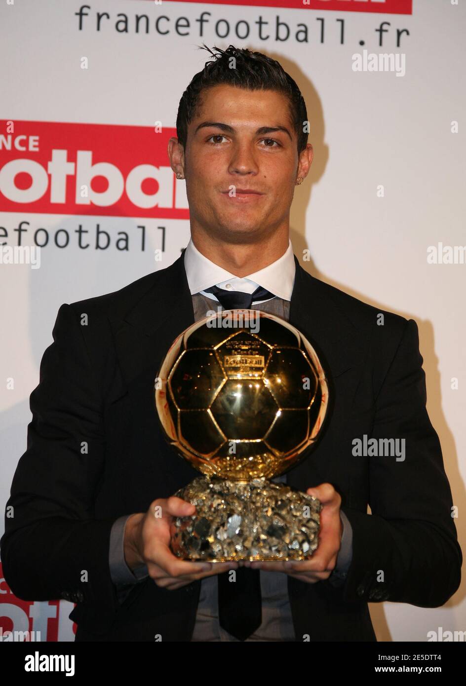 Portgual's Cristiano Ronaldo holds the 'Ballon D'Or France Football' Trophy  during press conference after french television TF1 football show.  Ronaldo's familly was there with Manchester United manager's Sir Alex  Ferguson. In Issy-les-Moulineaux