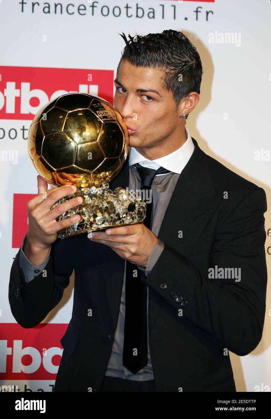 Portgual's Cristiano Ronaldo holds the 'Ballon D'Or France Football' Trophy  during press conference after french television TF1 football show.  Ronaldo's familly was there with Manchester United manager's Sir Alex  Ferguson. In Issy-les-Moulineaux