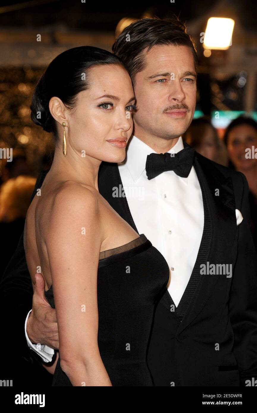 Cast member Brad Pitt and wife Angelina Jolie arriving for the premiere