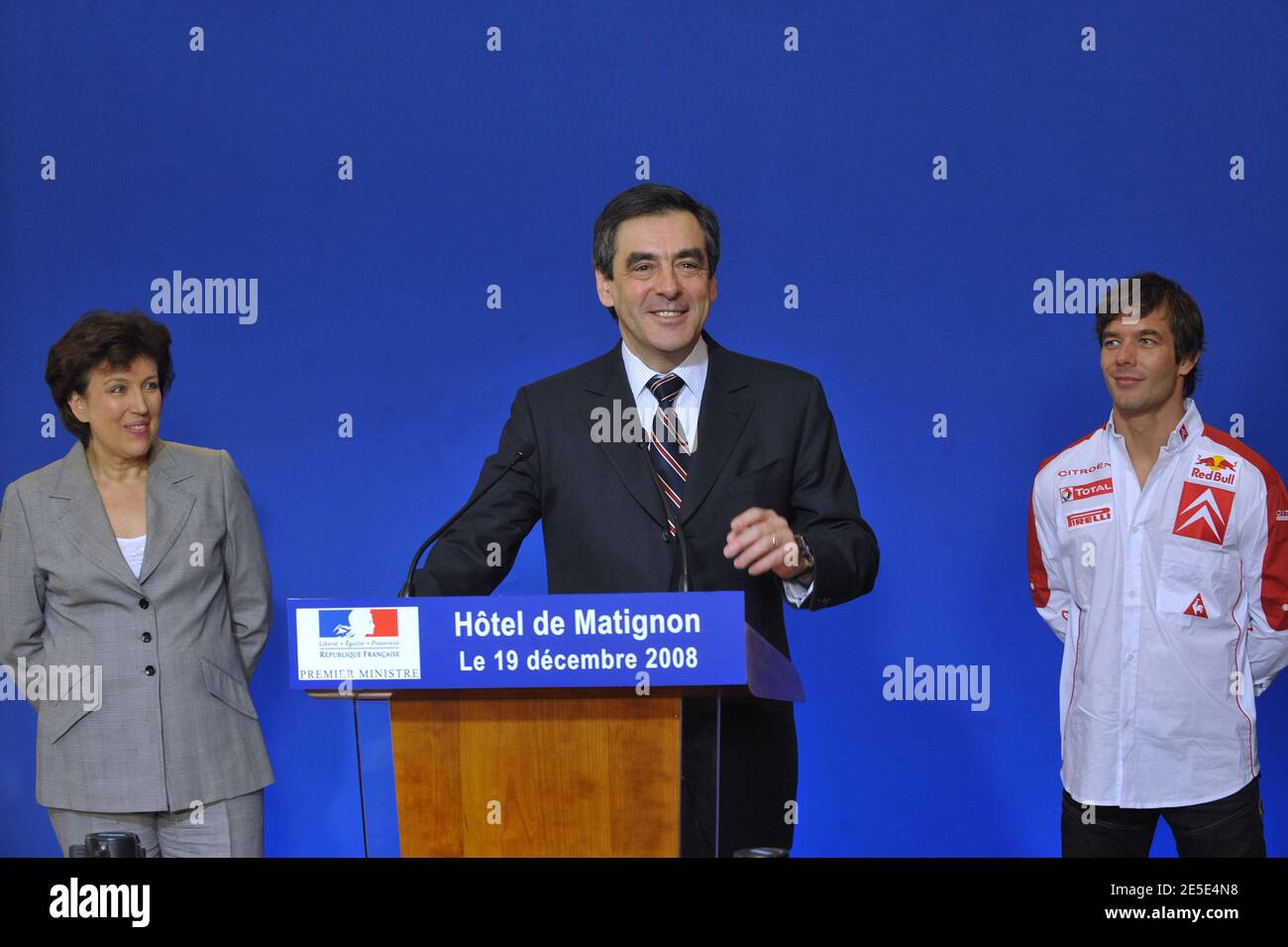 French Prime minister Francois Fillon speaks to journalists next to