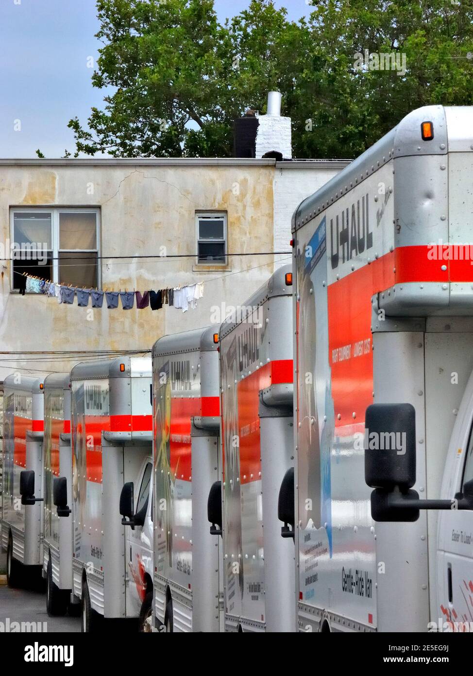 UHaul trucks lined up in a Brooklyn New York depot parking lot moving