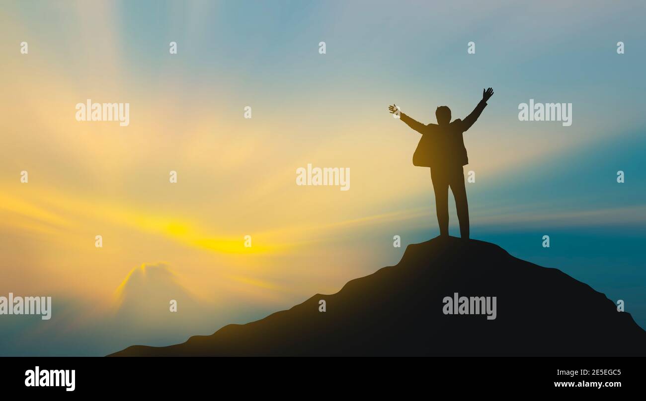 silhouette of man on mountain top over sky and sun light background ...