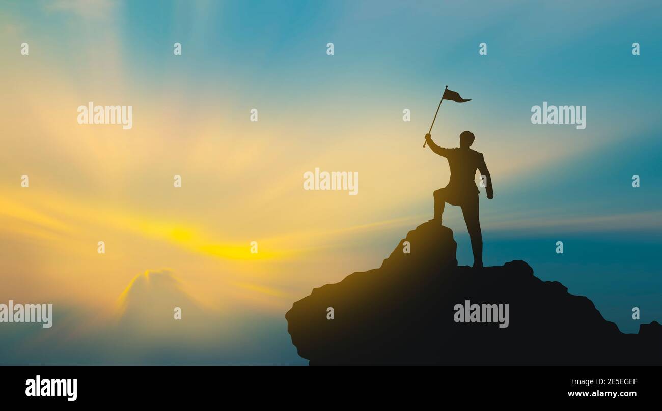 silhouette of man on mountain top over sky and sun light background ...