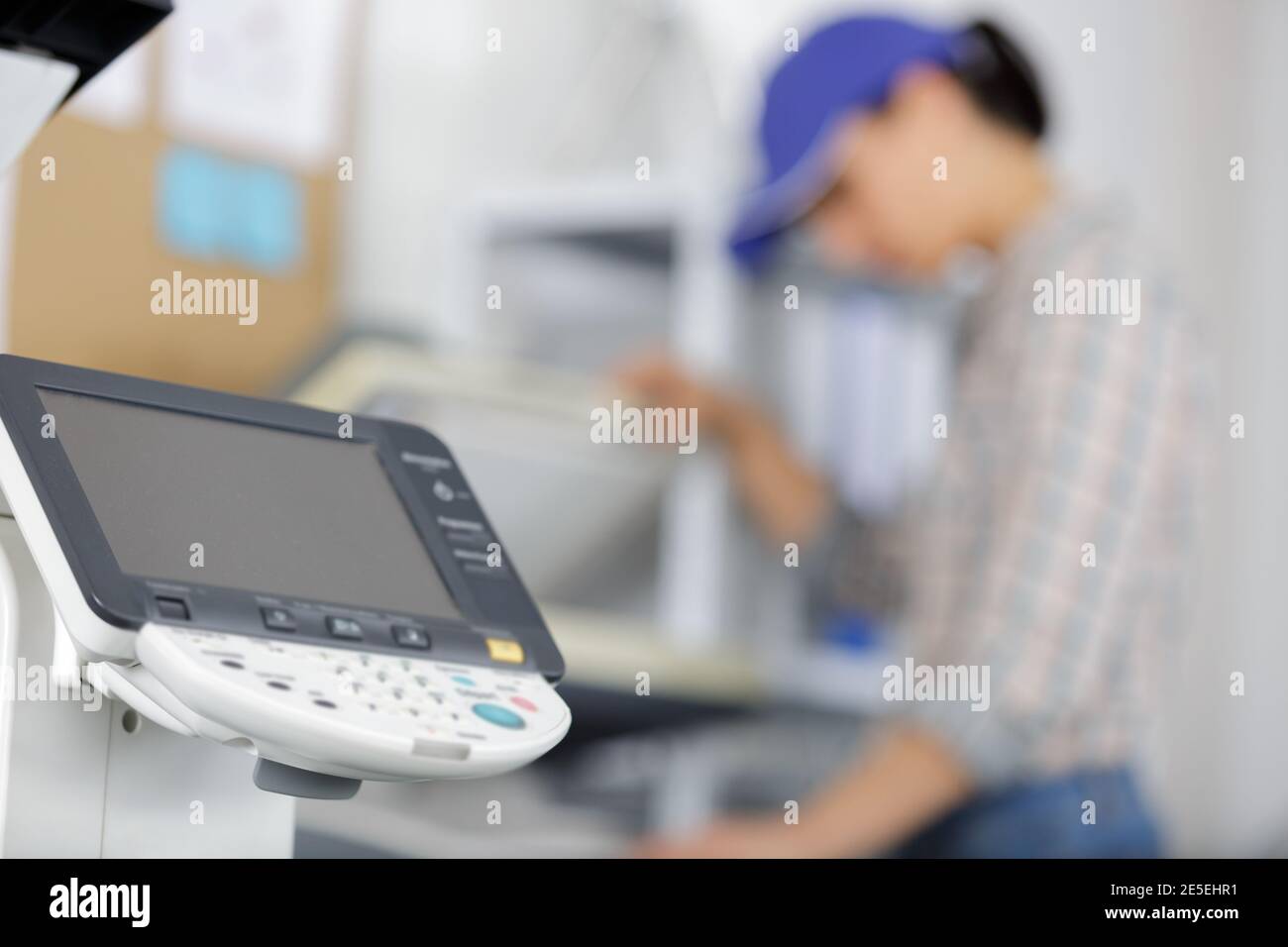 woman calibrating printer while working in nice printing office Stock Photo