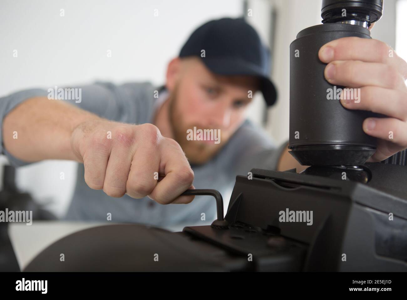 a handyman using allen key Stock Photo - Alamy