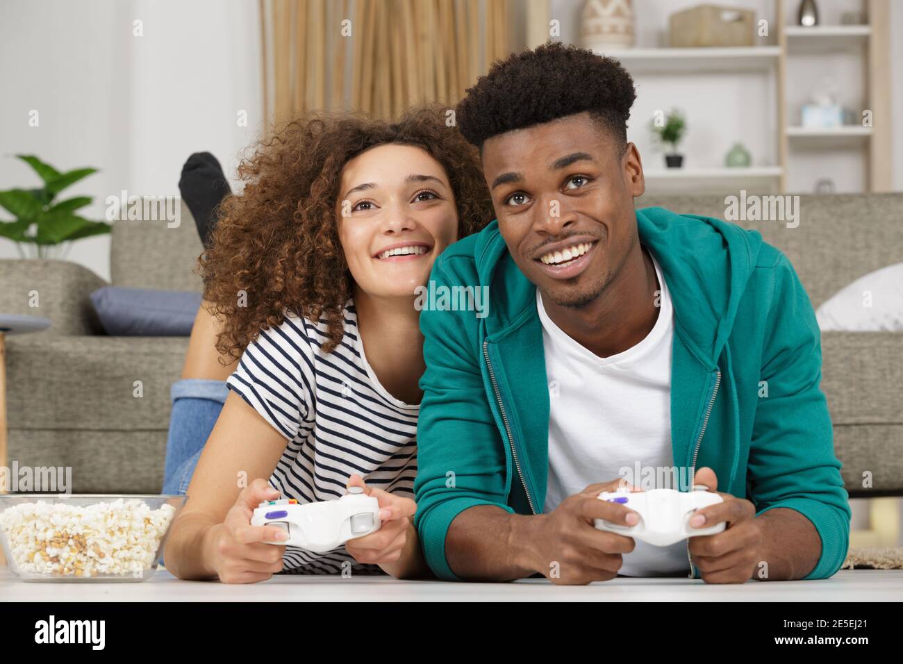 Cute couple playing video games hi-res stock photography and images - Alamy