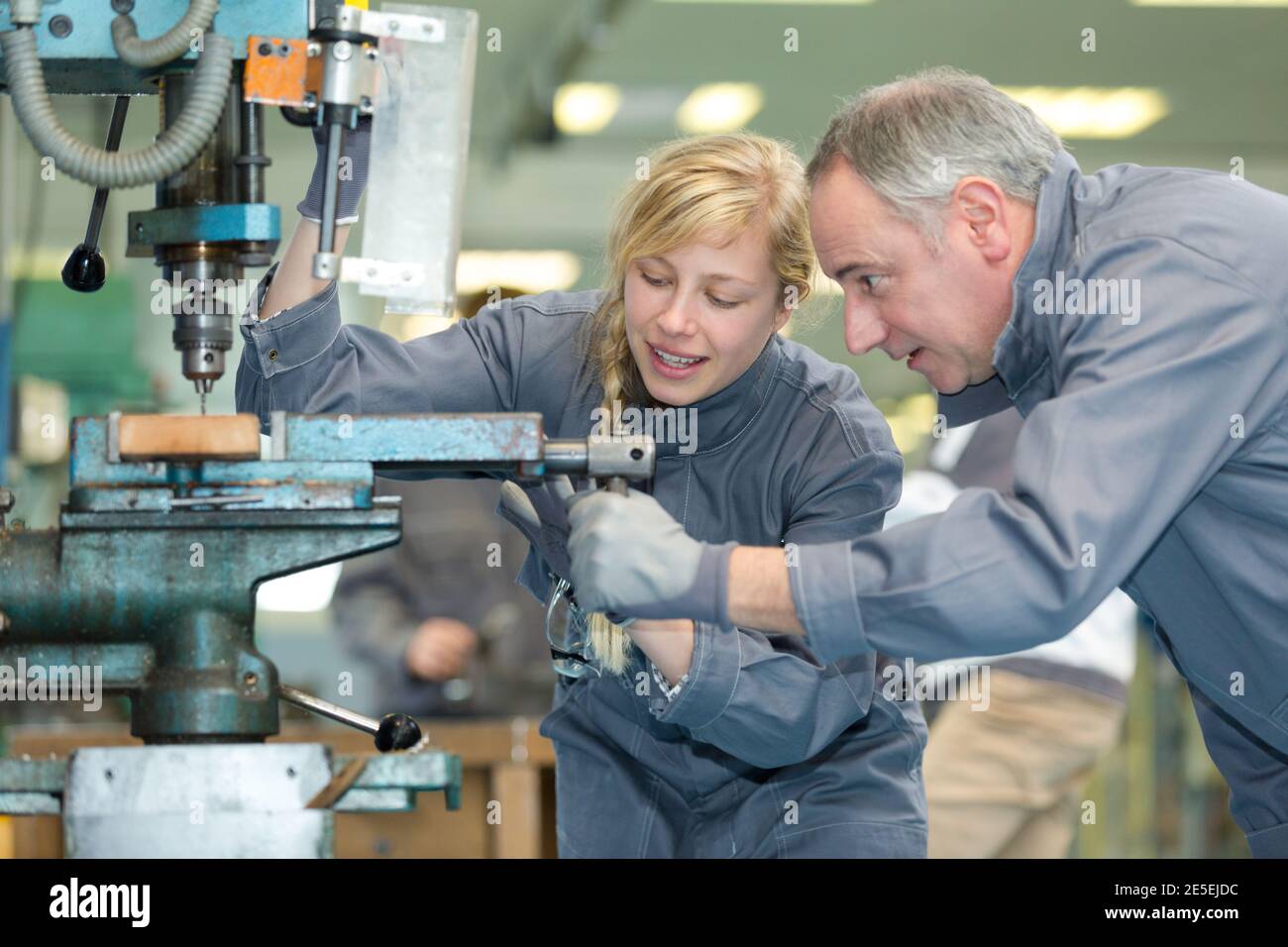 young woman working on milling machine Stock Photo - Alamy