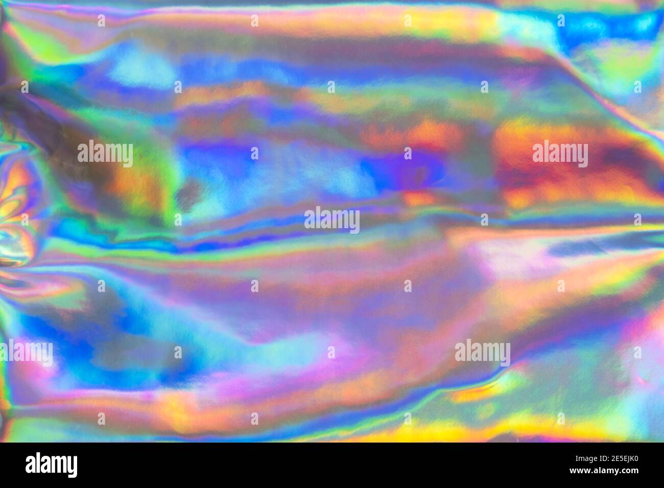 Iridescent neon background. Holographic wrinkled abstract foil texture ...
