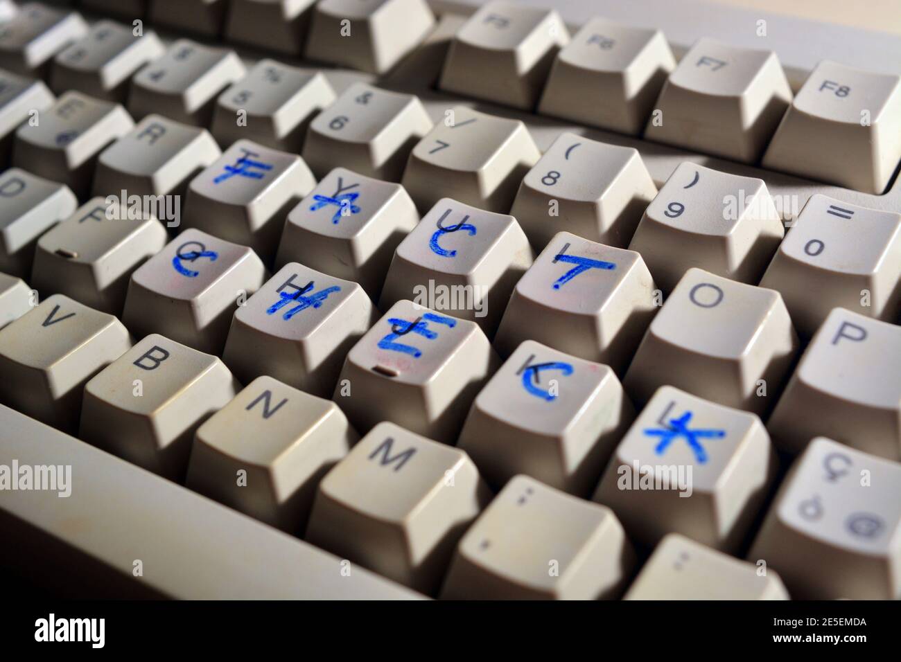 Detail of a computer keyboard with Fake news written on it with marker Stock Photo