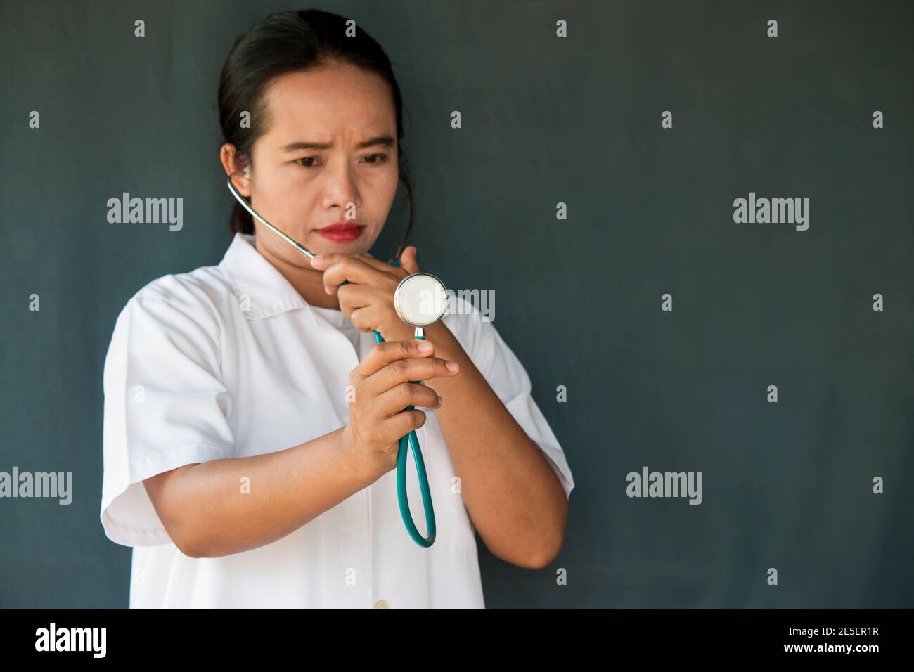 Female doctor in white coat hi-res stock photography and images - Alamy
