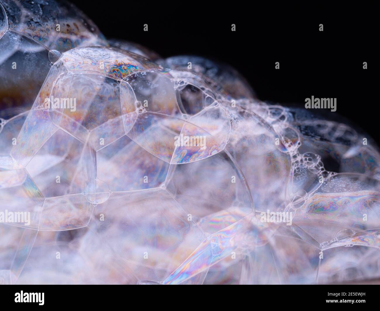 Pattern from soap foam. Abstract background with soap bubbles close up. Macro shot Stock Photo