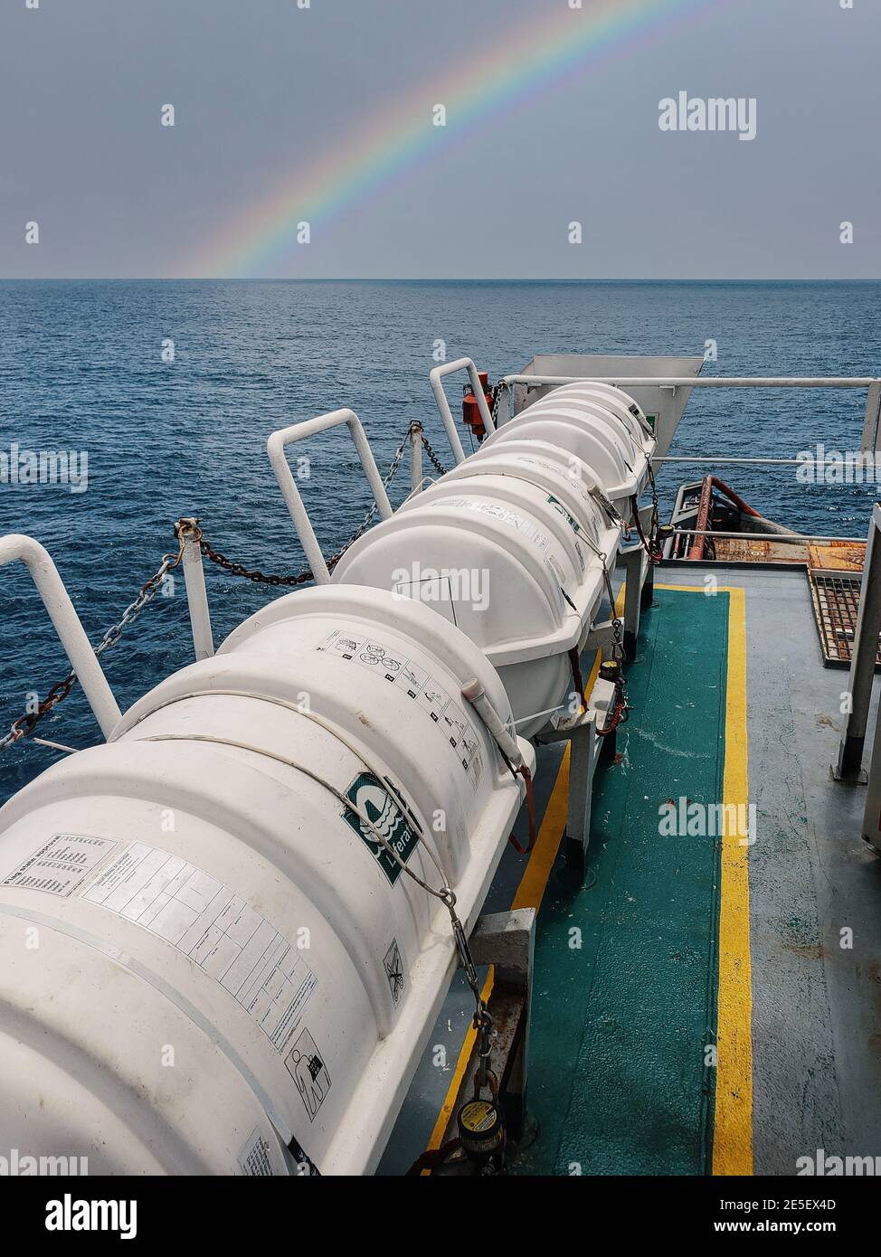 Liferafts on the deck of ocean offshore vessel. LSA life saving equipment. Stock Photo
