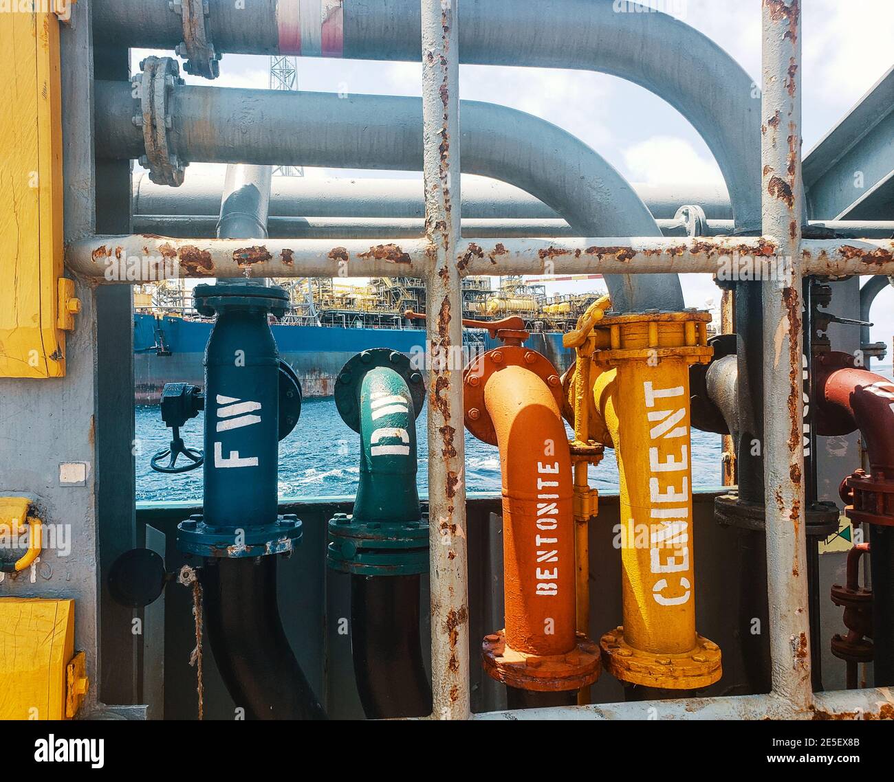 Offshore ship cargo manifolds ready to offload cargo to Floating production storage and offloading FPSO Stock Photo
