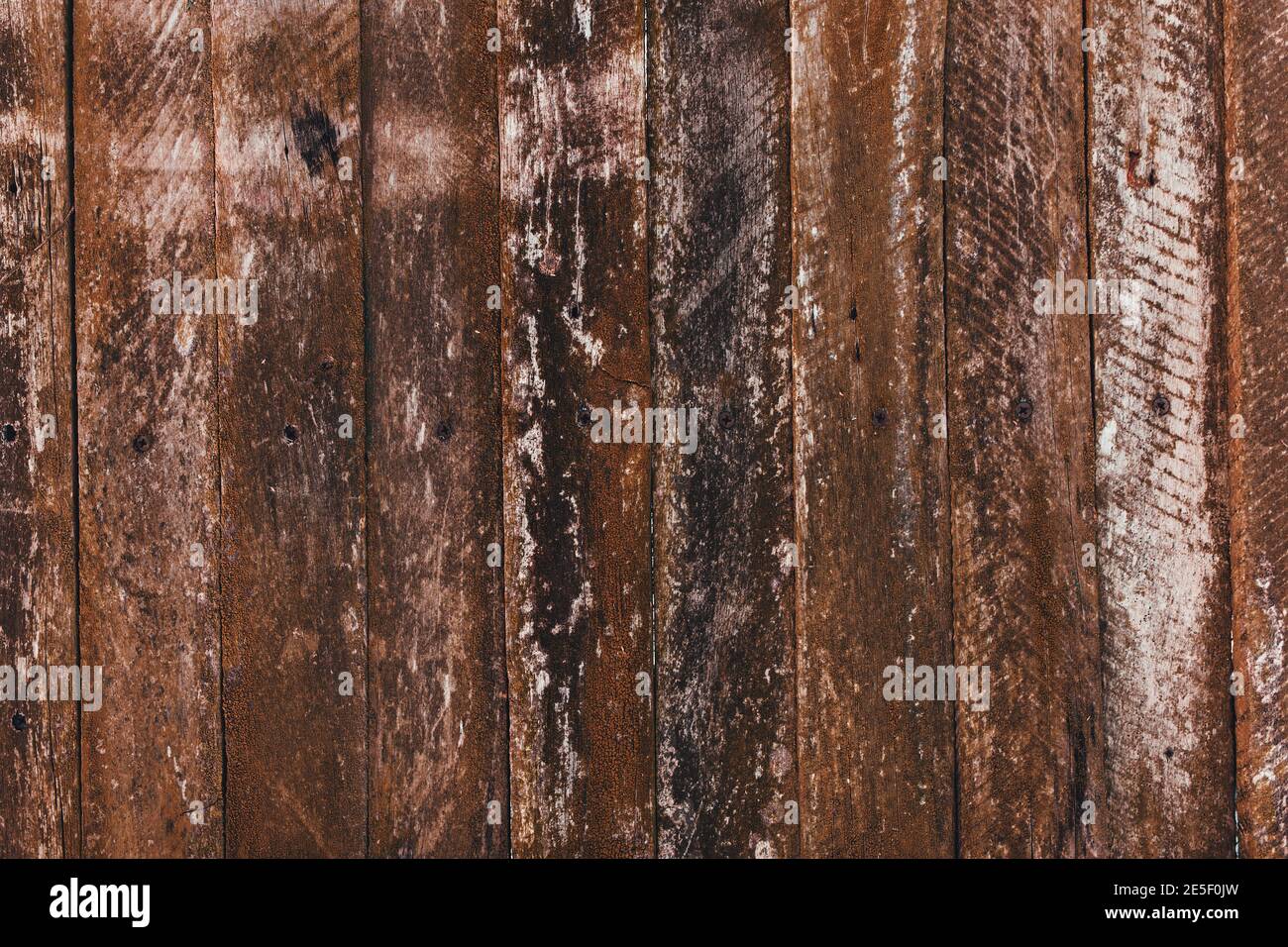 Brown old wooden fence background. Old boards texture Stock Photo