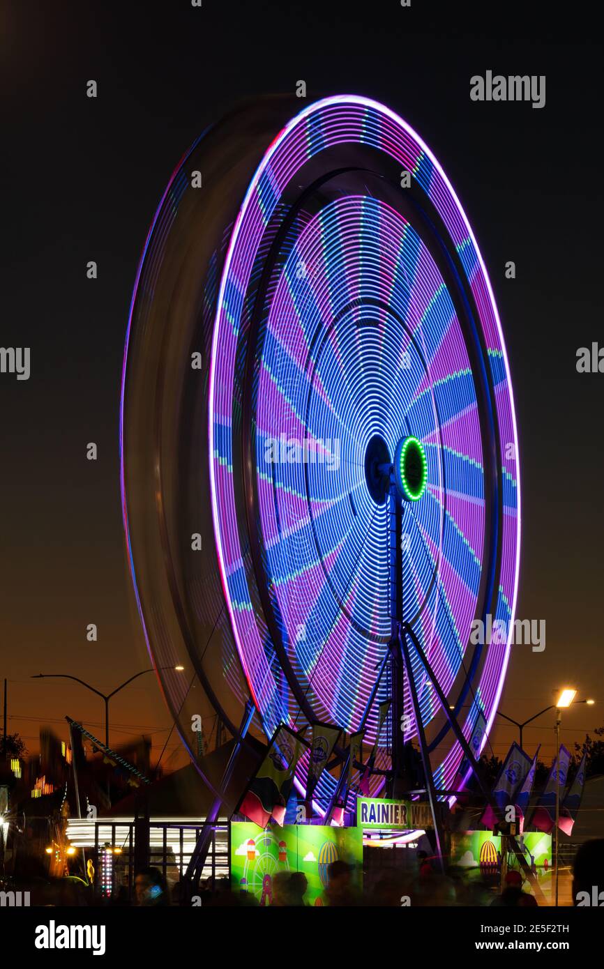 Lights on a spinning ferris wheel at dusk, Utah State Fair, Salt Lake