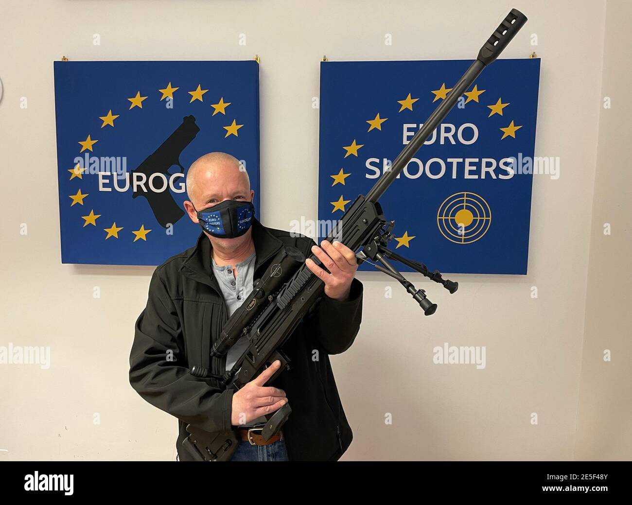 08 January 2021, Austria, Wien: Markus Schwaiger, Austrian arms dealer,  shows the bolt action rifle Savage Arms cal. 338 Lapua Magnum. The Savage  Arms cal. 338 Lapua Magnum is a bolt action