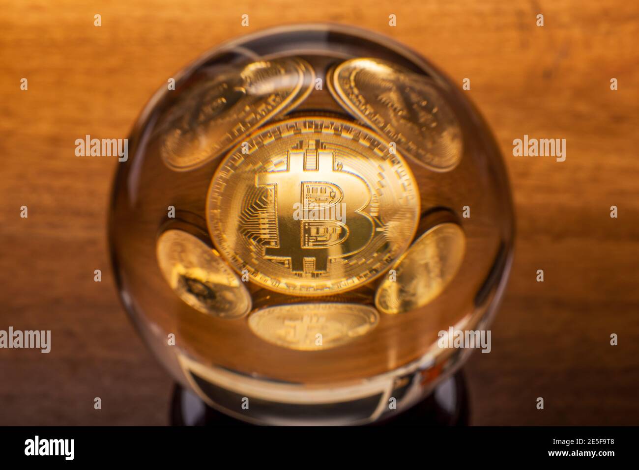 Bitcoin coins in a crystal ball close-up view Stock Photo - Alamy