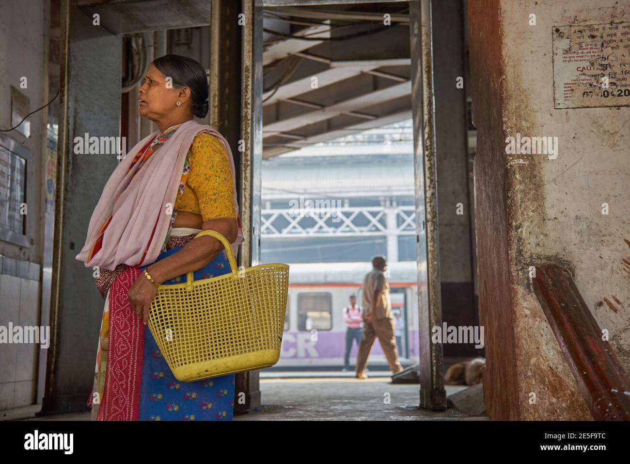 Having disembarked from a suburban train, a Mumbai housewife leaves Chhatrapati Shivaji Maharaj Terminus in Mumbai, the city's busiest railway station Stock Photo