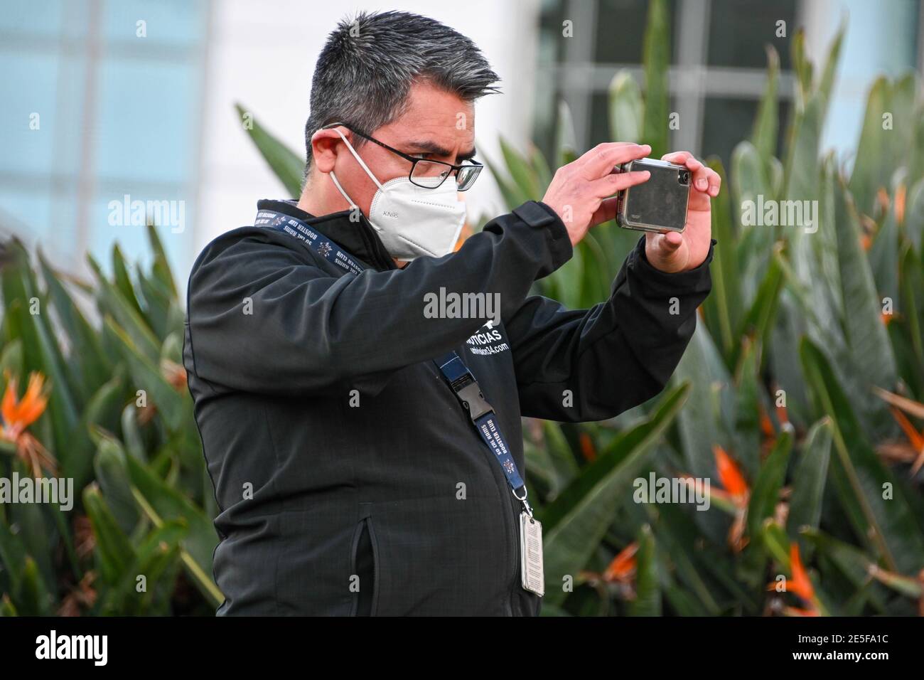 Univision reporter Armando Aguilera observes at a memorial for Kobe Bryant and daughter Gianna near Staples Center, Tuesday, Jan. 26, 2021, in Los Ang Stock Photo