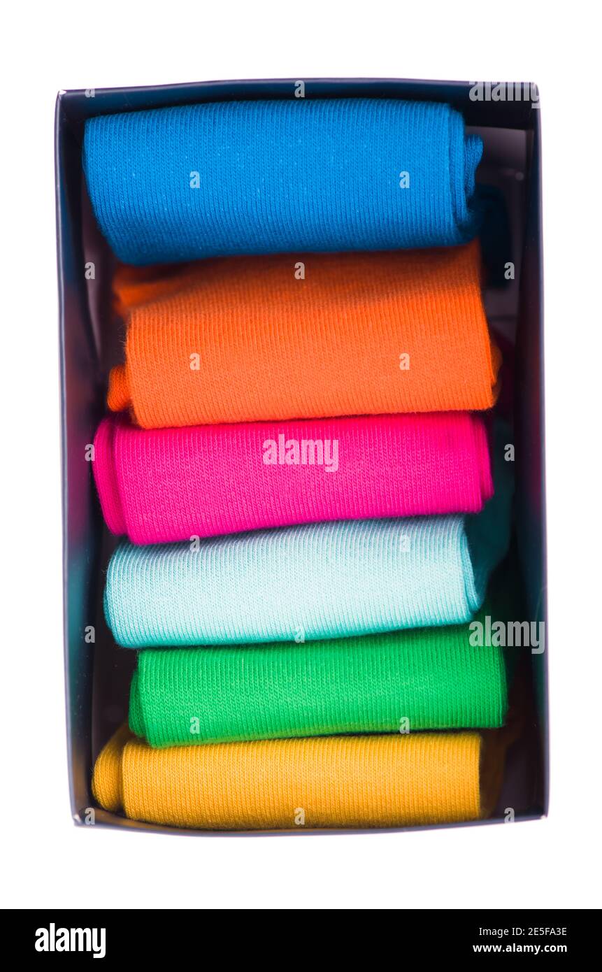 colored socks stacked on a white background Stock Photo