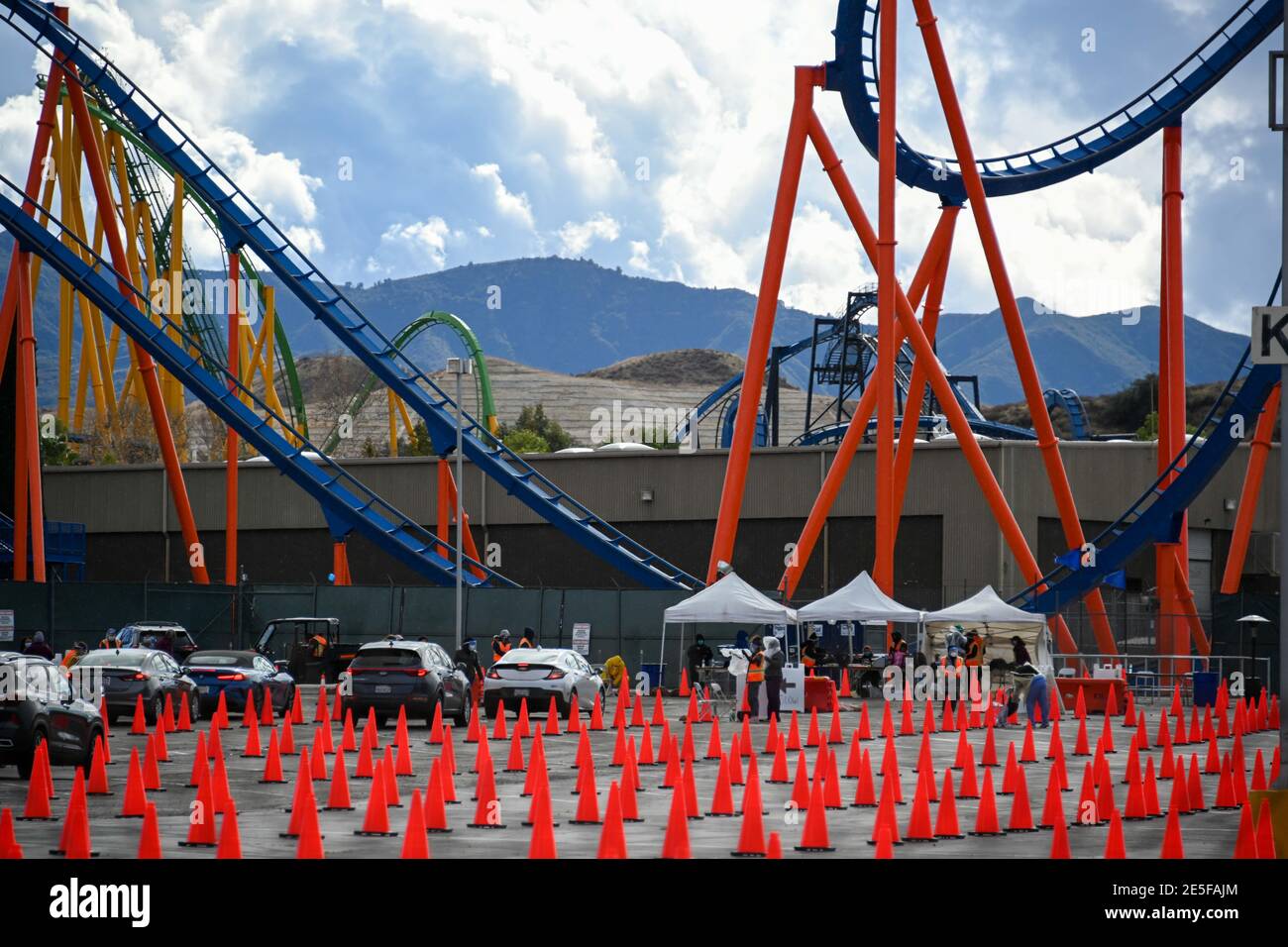 Motorists line up to receive the Covid-19 vaccine at Six Flags Magic Mountain, Monday, Jan. 25, 2021, in Valencia, Calif. (Dylan Stewart/Image of Spor Stock Photo