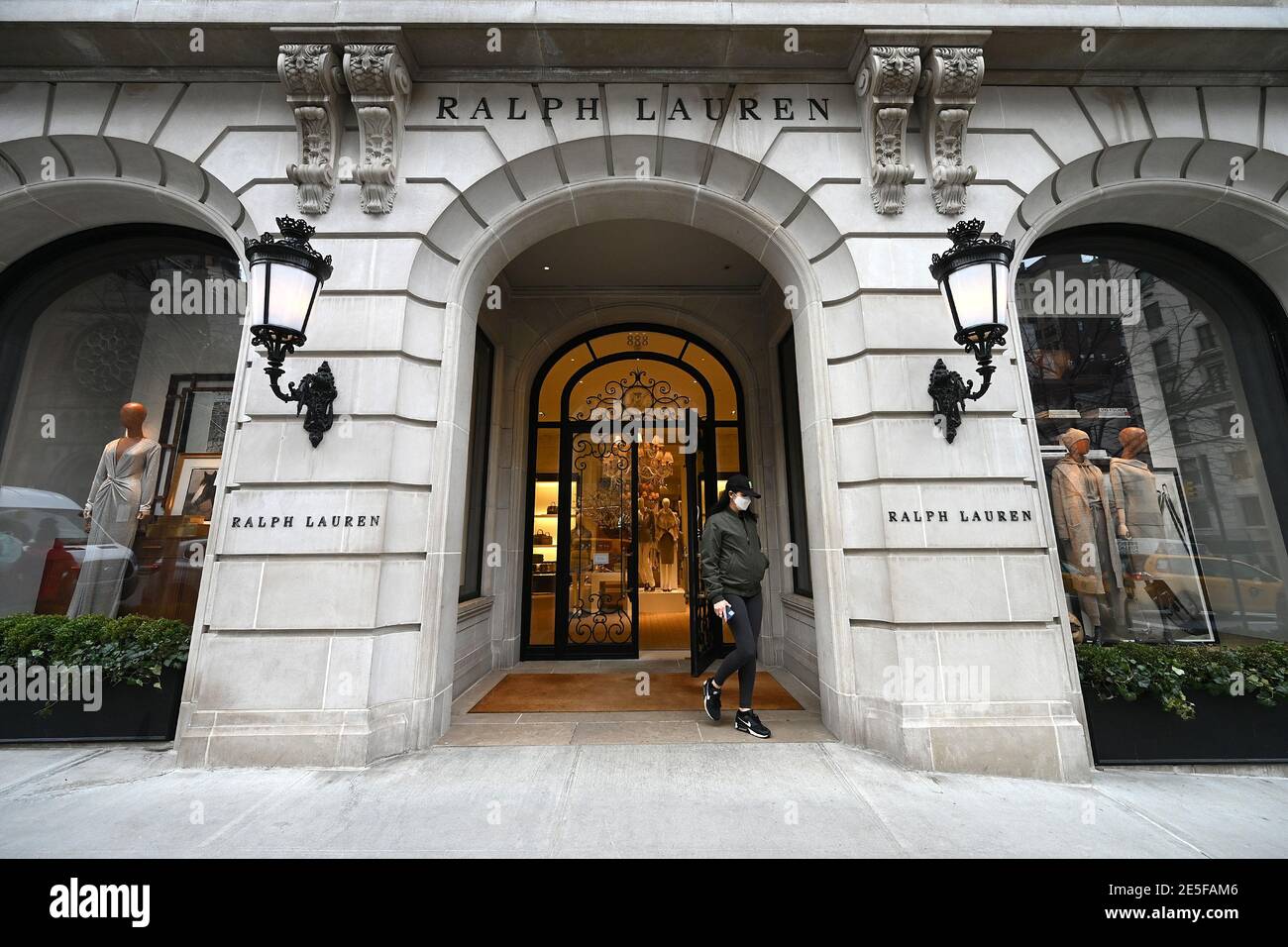 New York, USA. 27th Jan, 2021. A woman is seen exiting the Ralph Lauren  Women's fashion boutique on Madison Avenue in New York, NY, January 27,  2021. Fashion Week 2021 has started