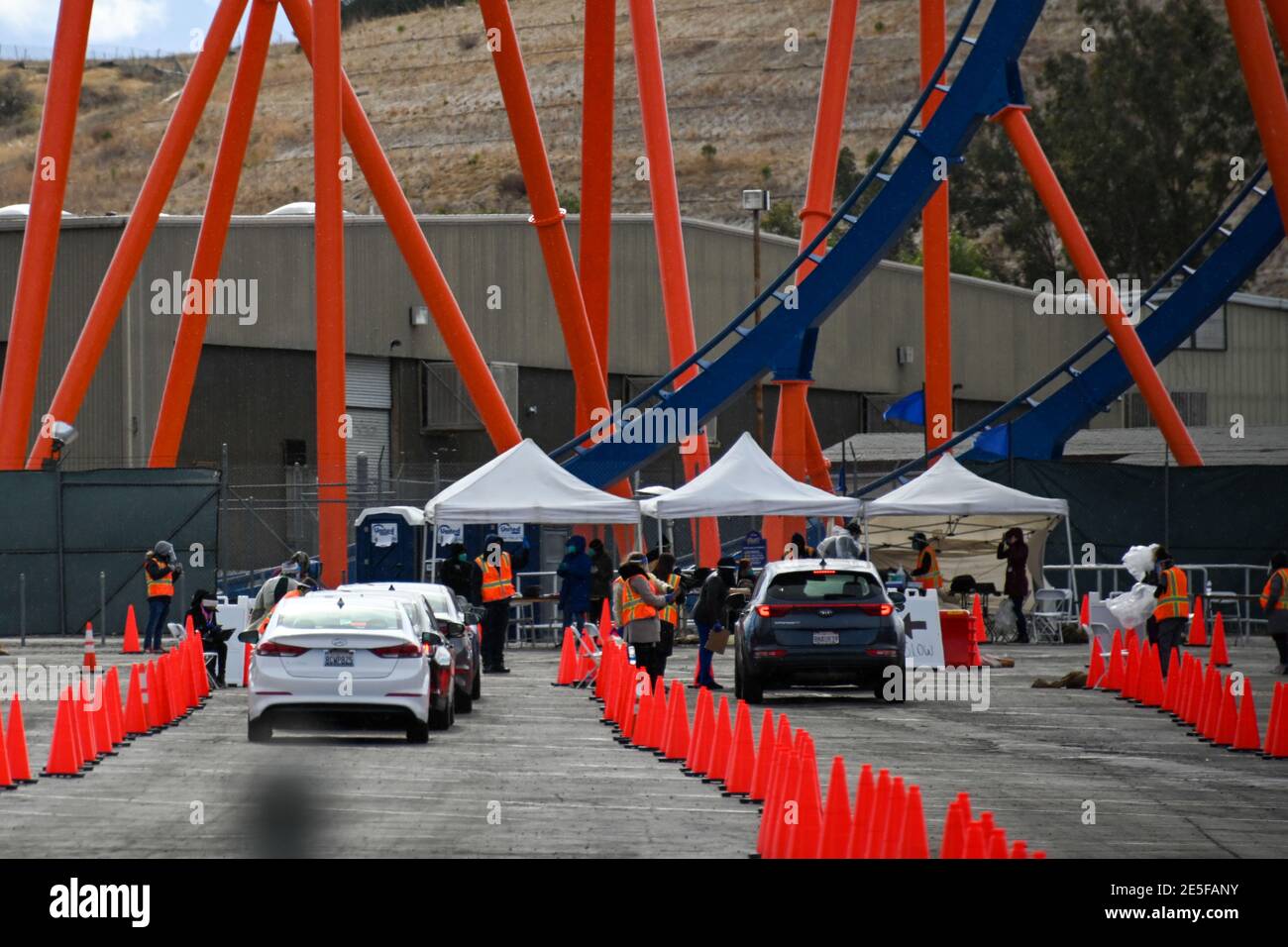 Motorists line up to receive the Covid-19 vaccine at Six Flags Magic Mountain, Monday, Jan. 25, 2021, in Valencia, Calif. (Dylan Stewart/Image of Spor Stock Photo