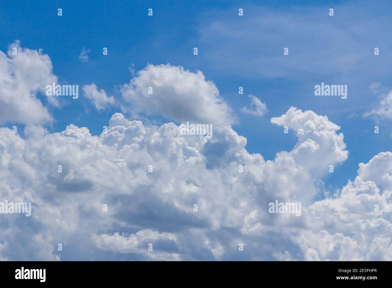 Blue sky with clouds and sun, Background Stock Photo - Alamy