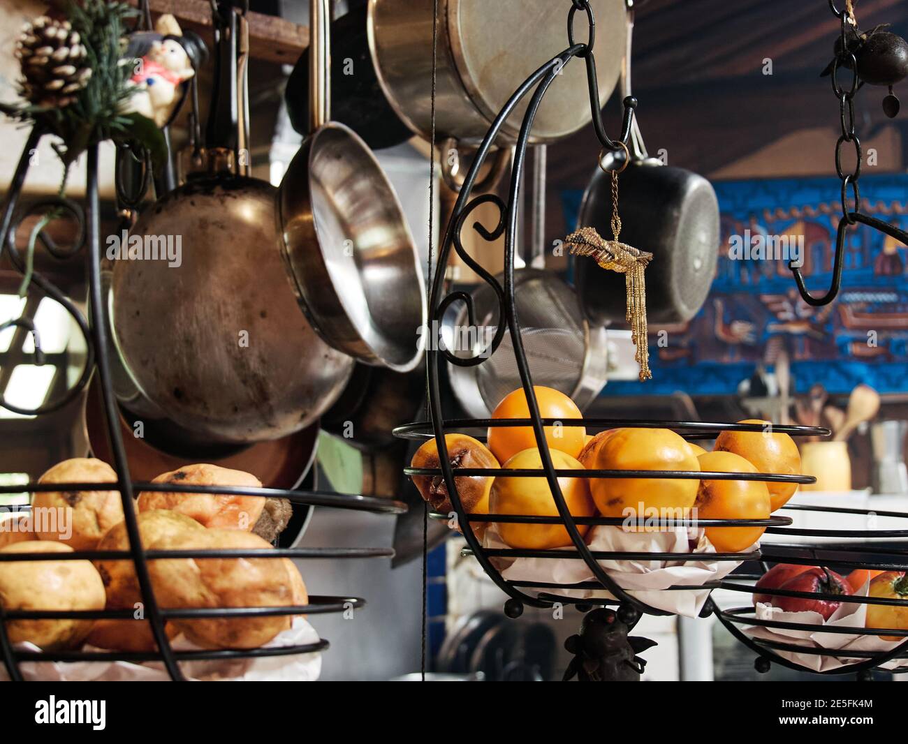 hanging kitchen utensils, fruits, pots, pans, vintage Stock Photo