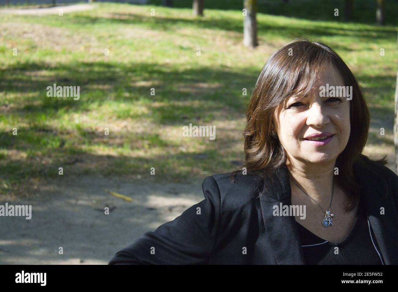 Mature woman in positive attitude sitting and standing Stock Photo - Alamy