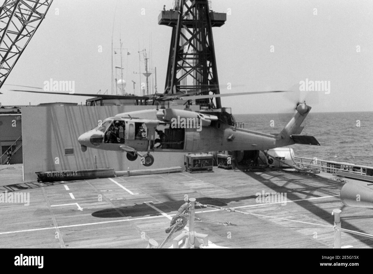MH-60 Blackhawk landing on Hercules. Stock Photo