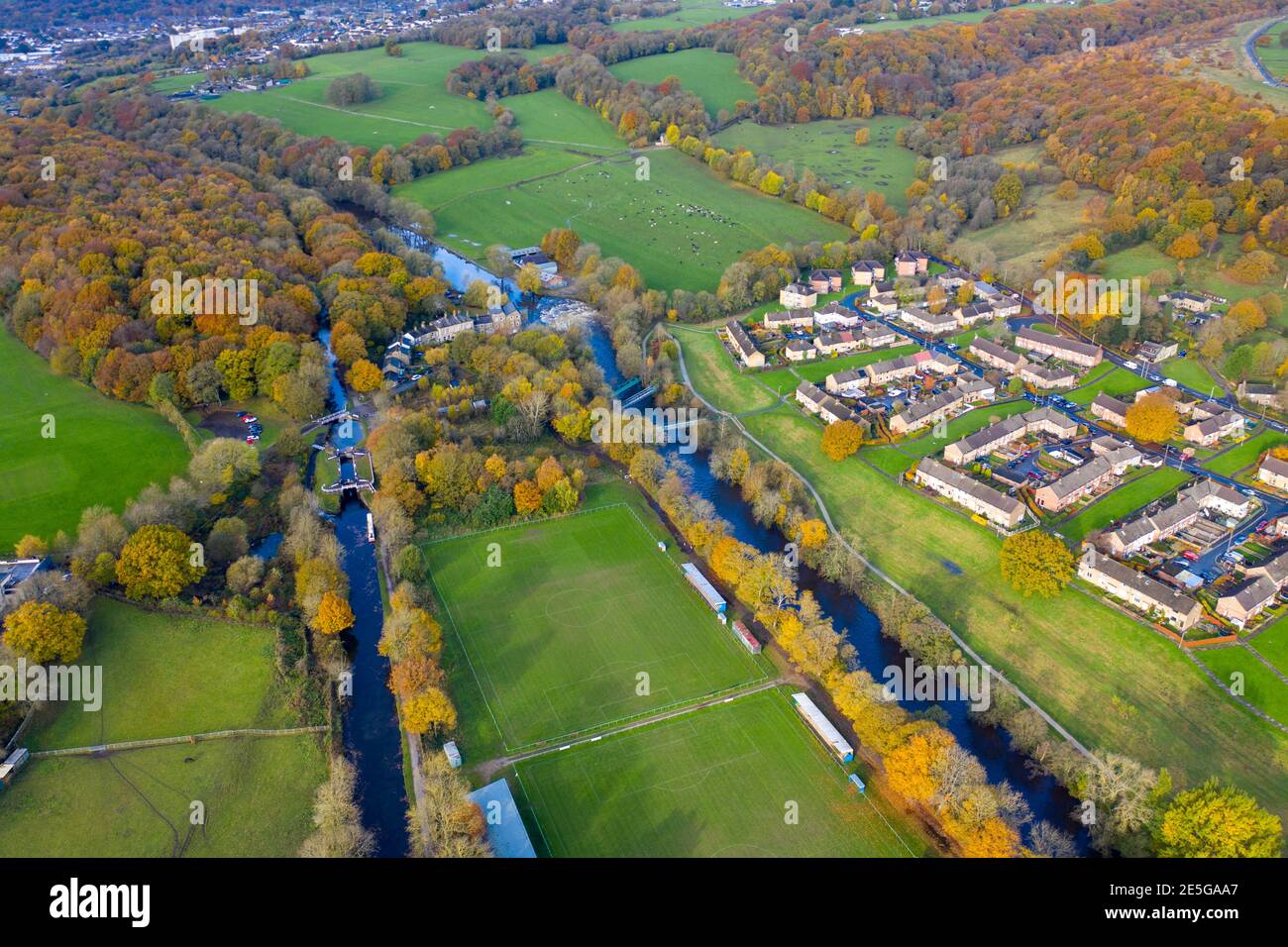 Aerial photo taken in the town of Shipley in Bradford West Yorkshire showing the Leeds & Liverpool canal taken in the Autumn time with brown leafs on Stock Photo