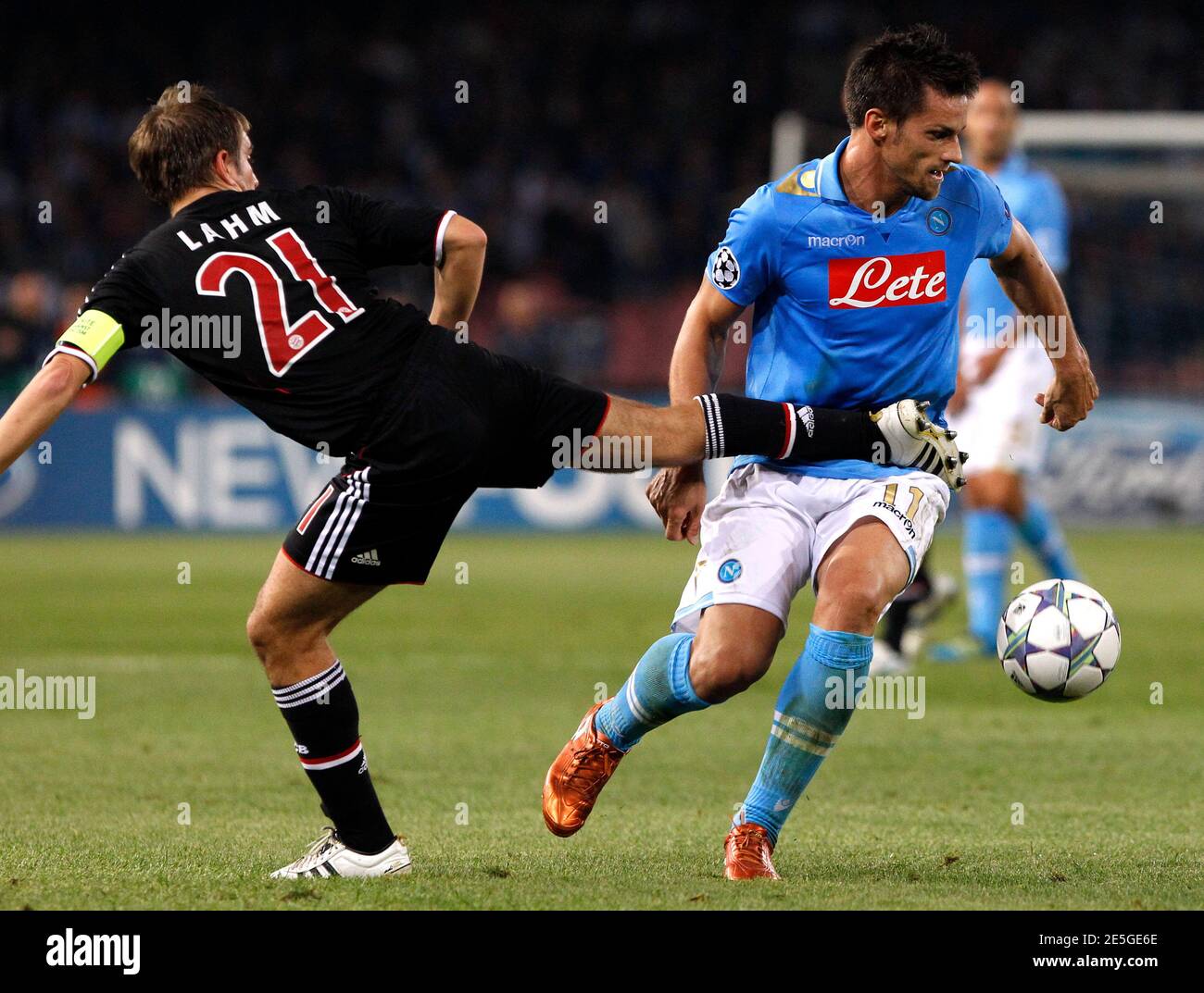 Napoli's Christian Maggio (R) challenges Philipp Lahm of Bayern Munich during their Champions League Group A soccer match at San Paolo stadium in Naples October 18, 2011.  REUTERS/Alessandro Bianchi( ITALY - Tags: SPORT SOCCER) Stock Photo