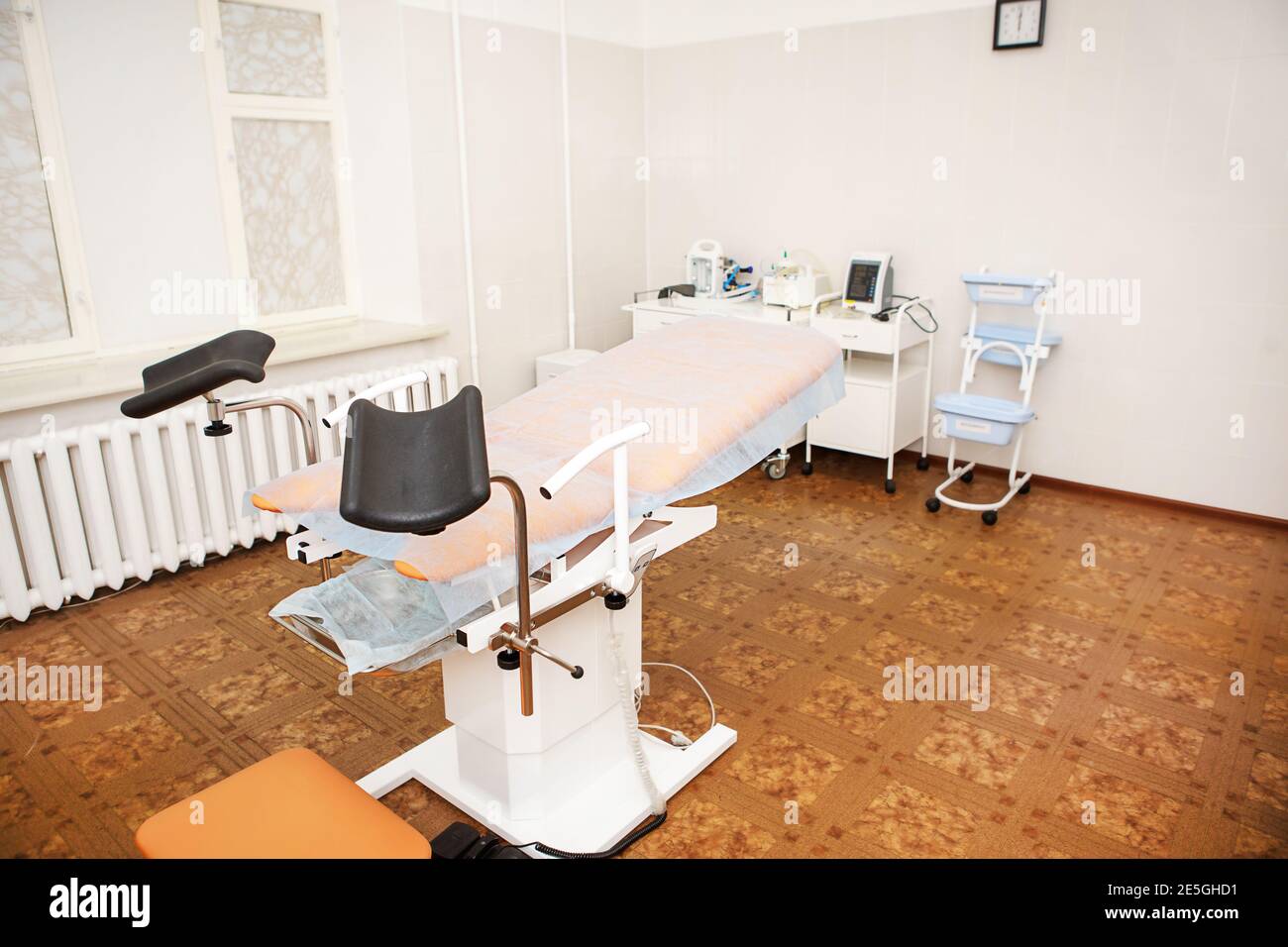 Gynecological chair in the clinic for artificial insemination and reproduction of women. Couch and medical equipment for examination, termination of p Stock Photo