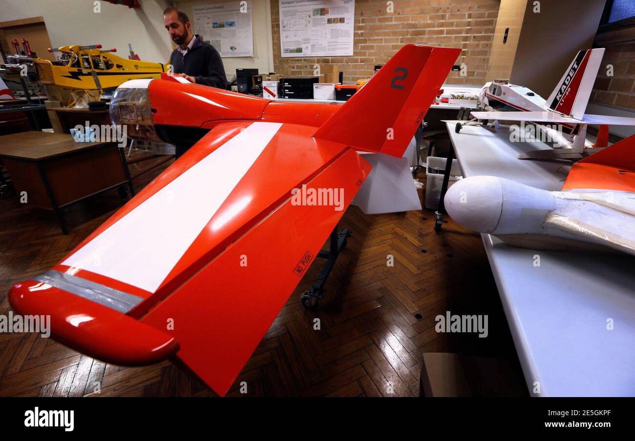Salah Sukkarieh, professor of Robotics and Intelligent Systems at the University of Sydney, Australian Centre for Field Robotics, stands next to one of his robotic aircraft in his laboratory in Sydney April 24, 2013. Australian farmers are increasingly turning to science to maximise yields, with agricultural robots and existing technology a likely future for the average farm. With mounting challenges that include increasing climate variability, dwindling arable land and a shortage of labour - Australia has set itself the ambitious target of being the 'food bowl of Asia', a goal that would requ Stock Photo