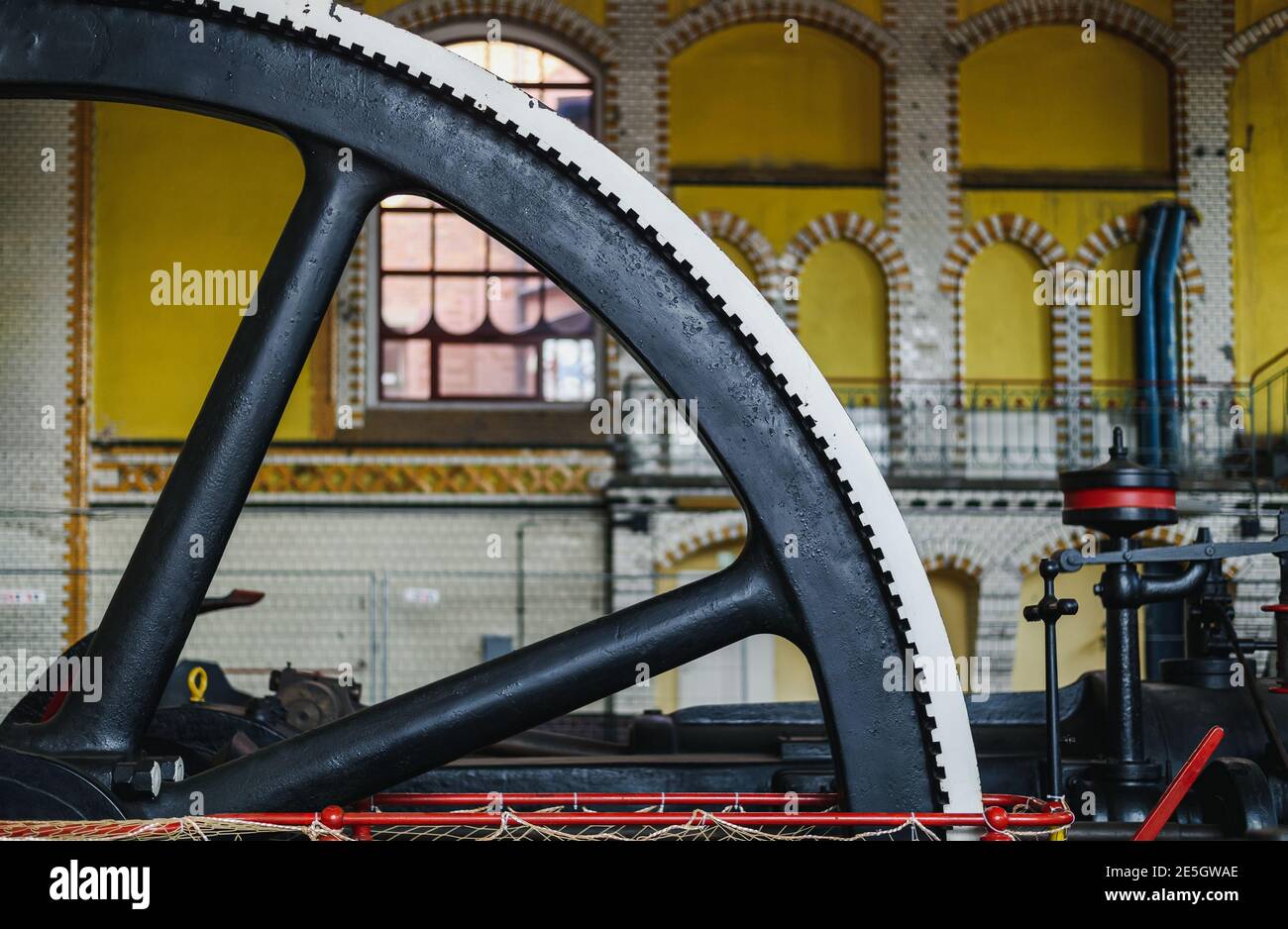 Old steam machine, steam pump wheel. Industrial historic heritage Stock Photo