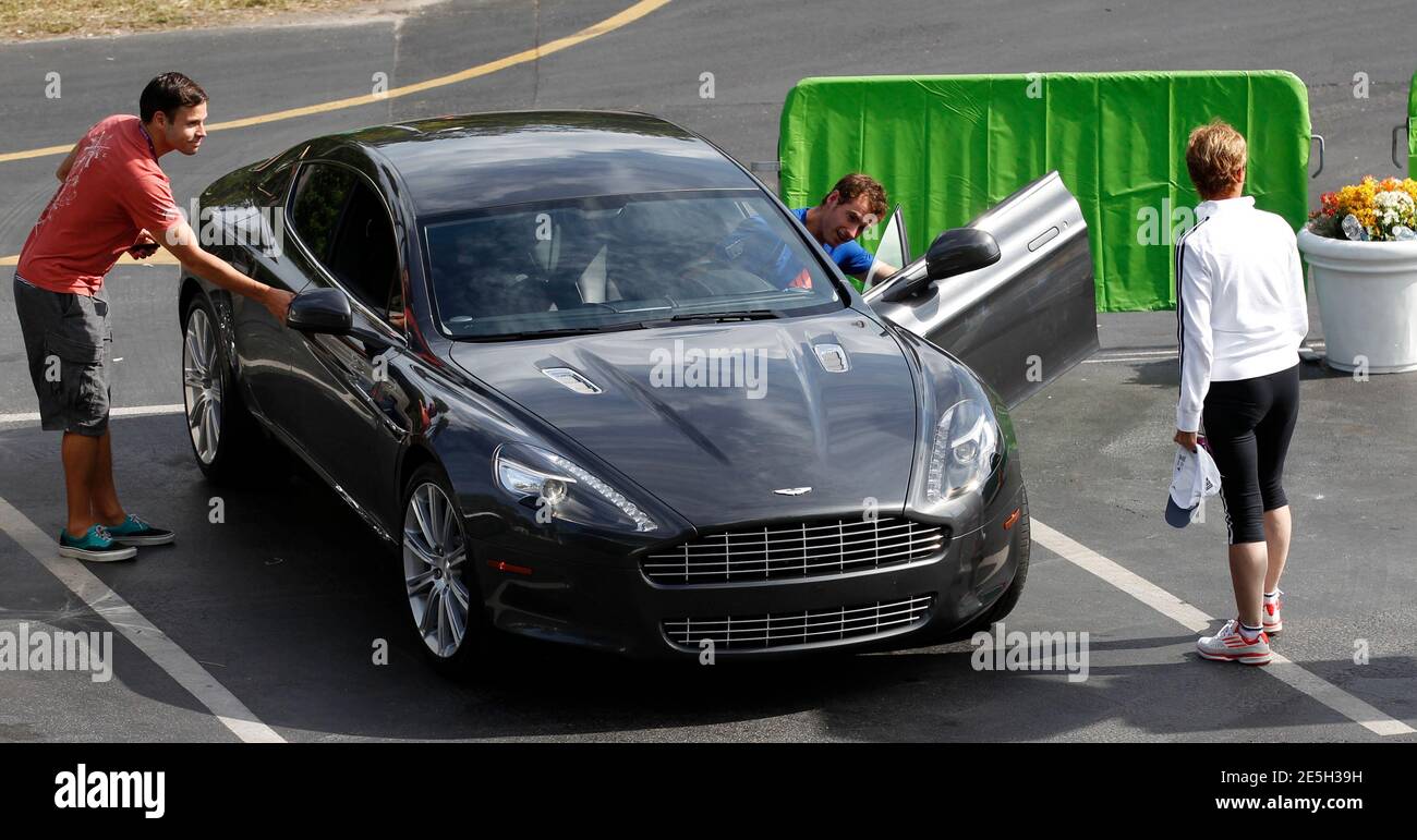 British tennis player Andy Murray gets into an Aston Martin at the Sony Ericsson Open tennis tournament in Key Biscayne, Florida March 20, 2012. Watching at right is his mother Judy.  REUTERS/Kevin Lamarque  (UNITED STATES) Stock Photo