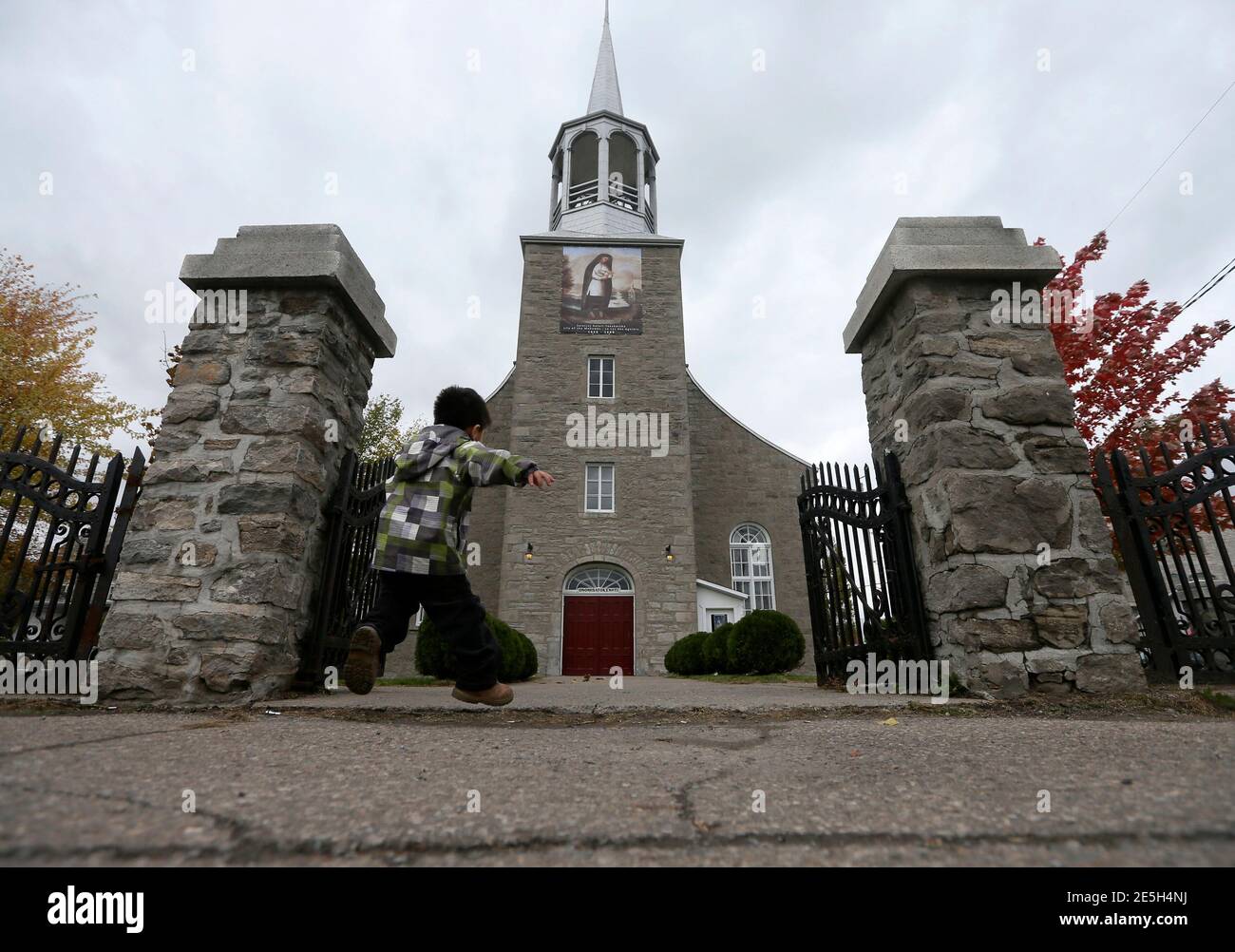 The faithful attend a special mass commemorating the canonization of