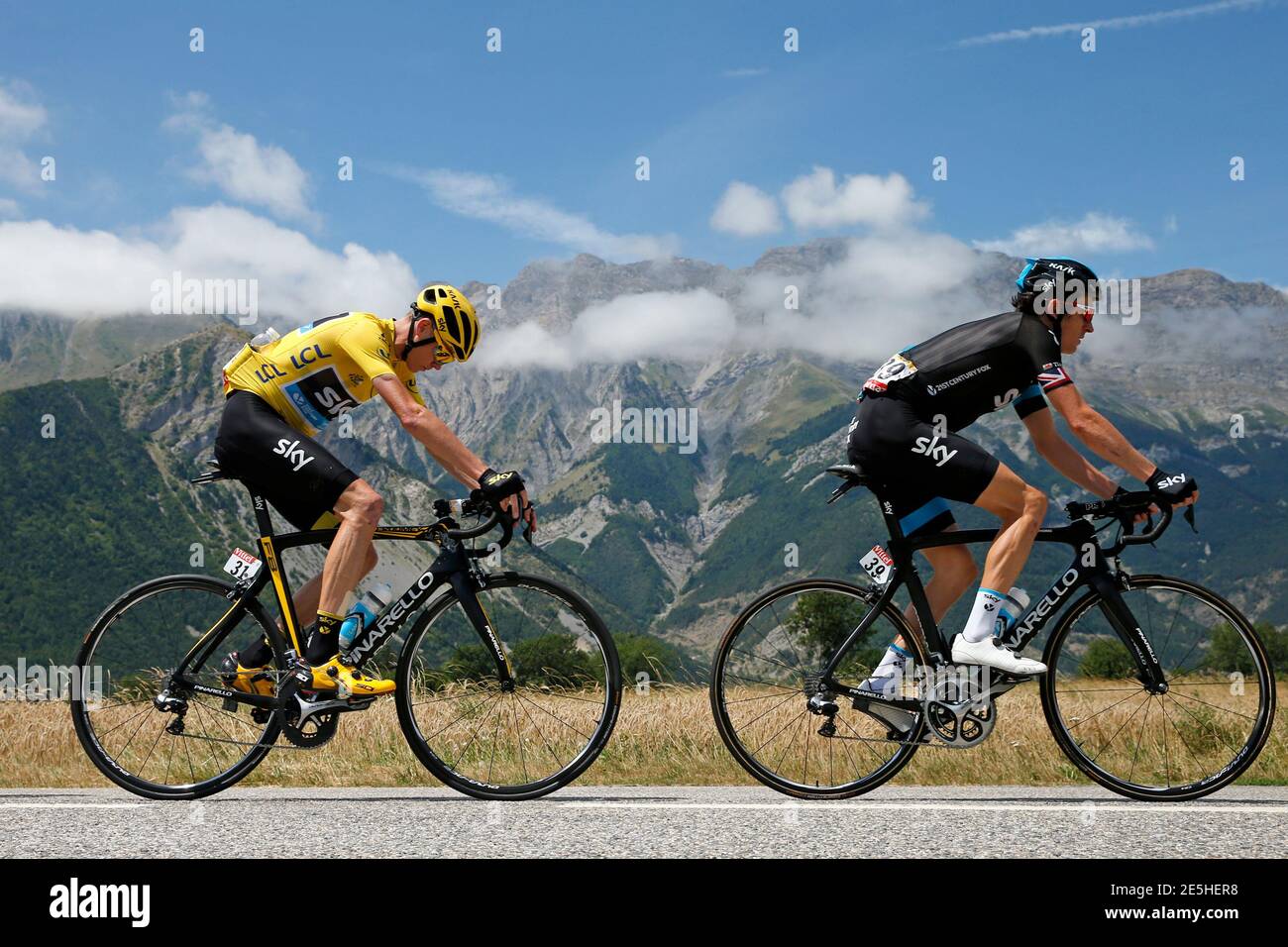 Team Sky riders Geraint Thomas of Britain and Chris Froome of Britain (L),  race leader's yellow jersey, cycle during the 186.5-km (115.88 miles) 18th  stage of the 102nd Tour de France cycling