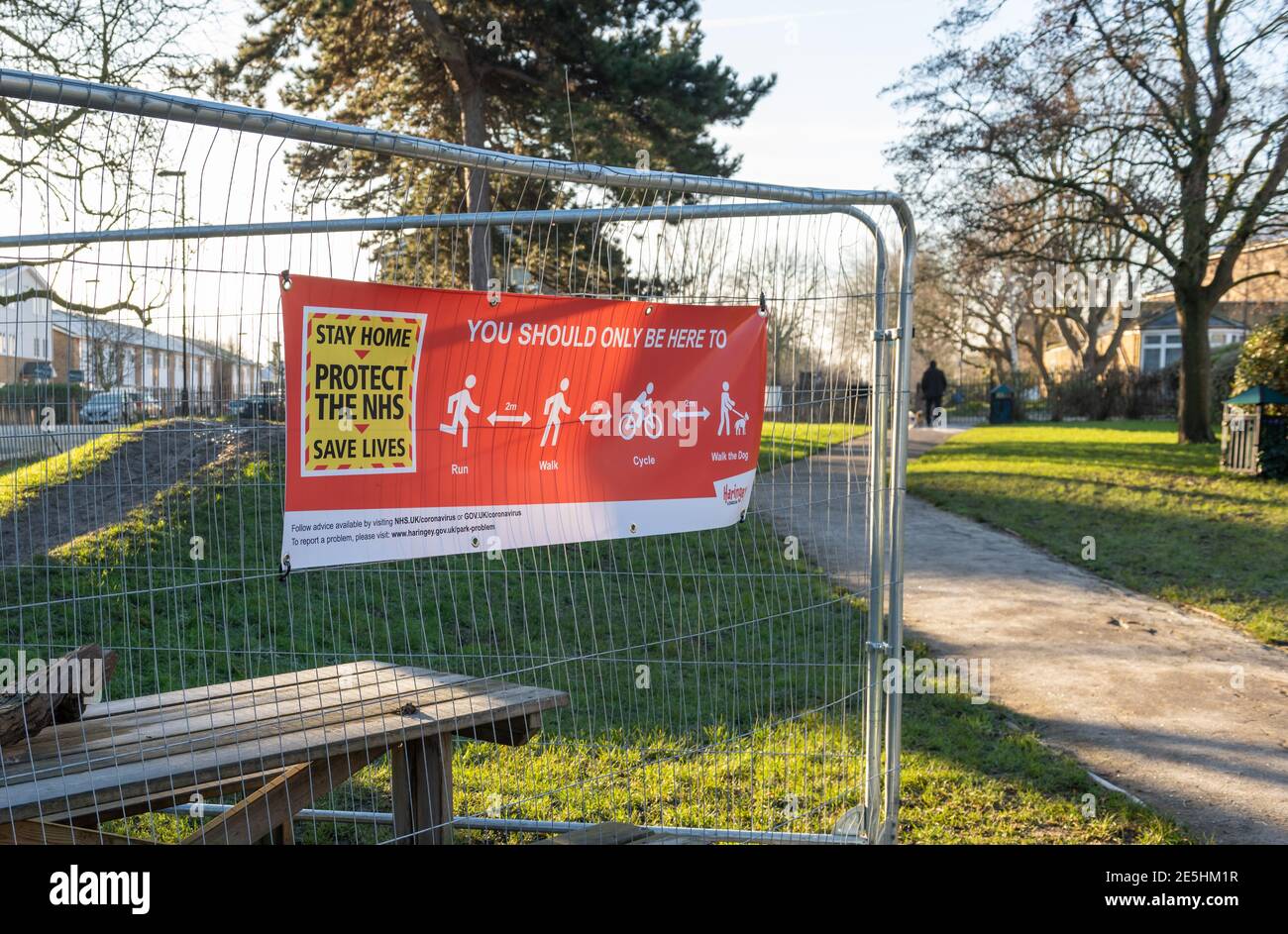 A government Covid-19 lockdown information banner in a park informing the public of outdoor exercise rules. Stock Photo
