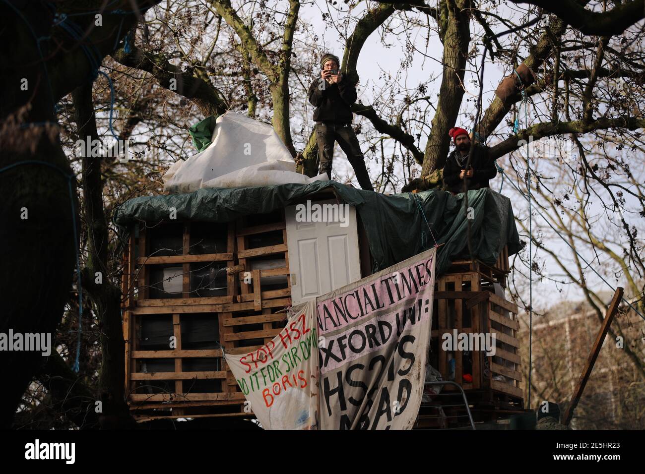 HS2 protesters in trees at the encampment in Euston Square Gardens in central London, where they have built a 100ft tunnel network, which they are ready to occupy, after claiming the garden is at risk from the HS2 line development. Picture date: Thursday January 28, 2021. Stock Photo