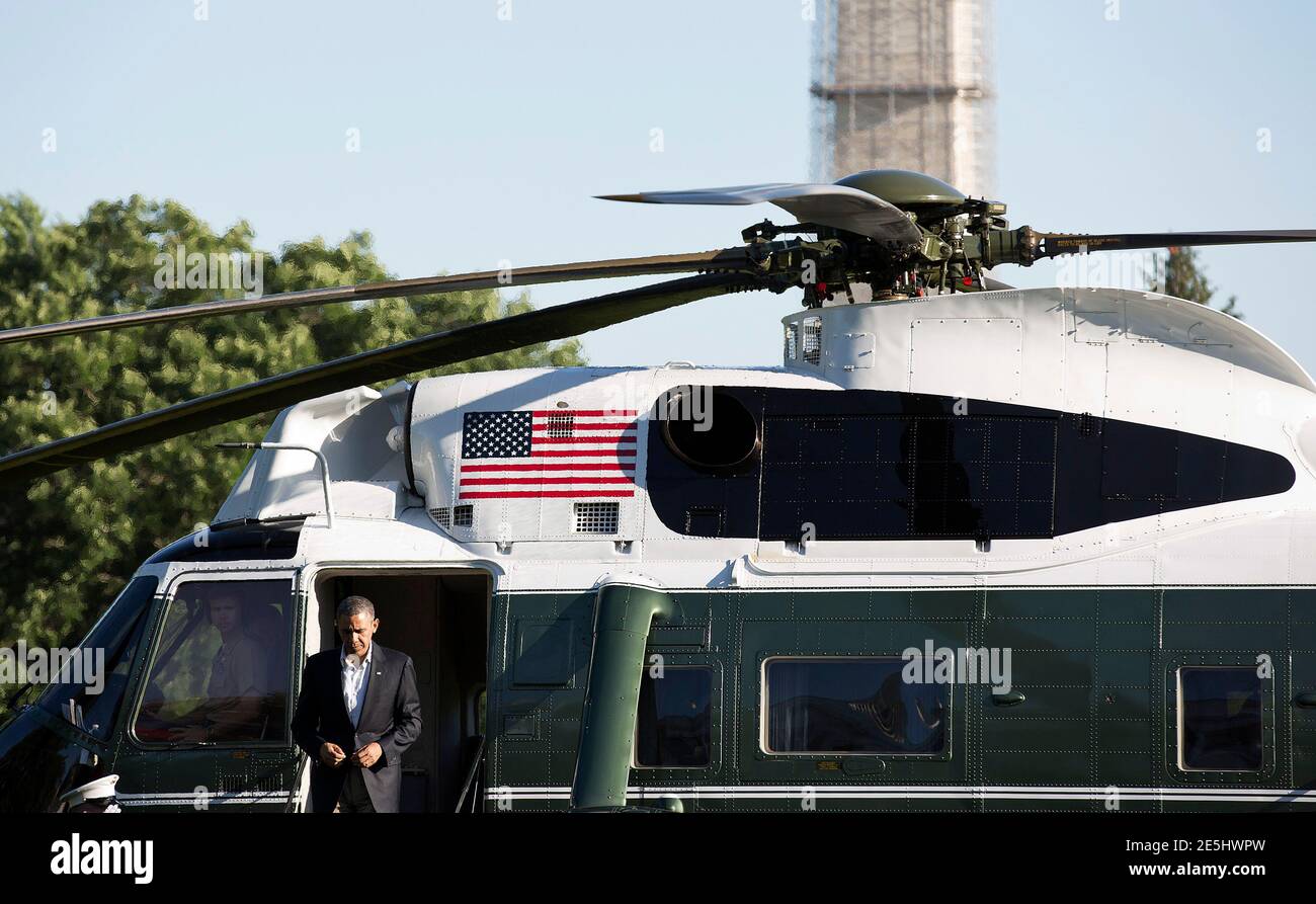 U.S. President Barack Obama walks from Marine One after returning to the White House in Washington on May 26, 2013. Obama is returning from Moore, Oklahoma, where he surveyed the damage from tornadoes that struck last week.     REUTERS/Joshua Roberts    (UNITED STATES - Tags: POLITICS) Stock Photo