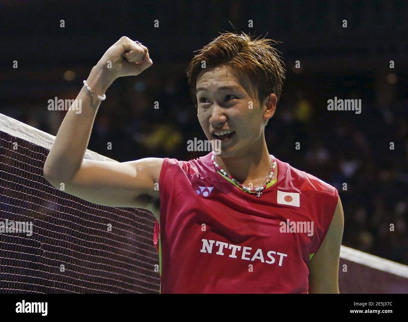 Kento Momota of Japan celebrates after defeating Hu Yun of Hong Kong during their men's singles final badminton match at the Singapore Open April 12, 2015. REUTERS/Edgar Su Stock Photo