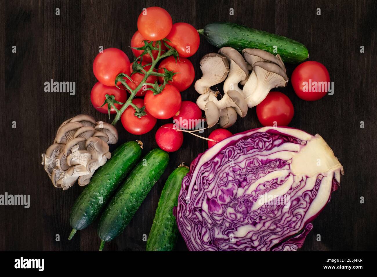 Vegetables in reusable net bags on grey wooden background, top view. Zero waste and eco friendly concept Stock Photo