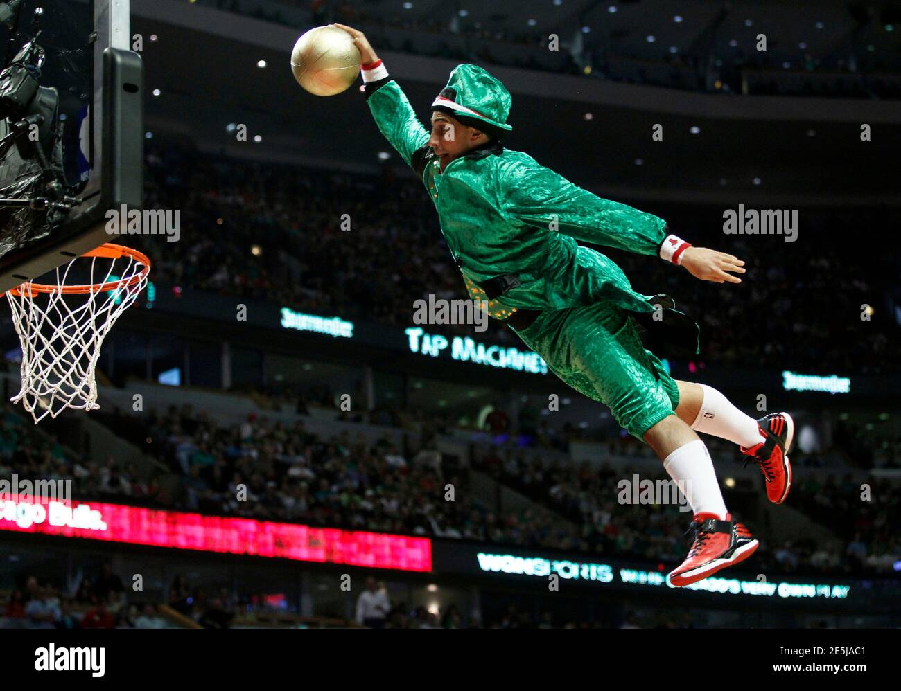 A Member Of The Benny And The Elevators Acrobatic Team Dressed In A Leprechaun Outfit For St Patrick S Day Performs During The Nba Basketball Game In Chicago March 17 2012 Reuters Jeff Haynes