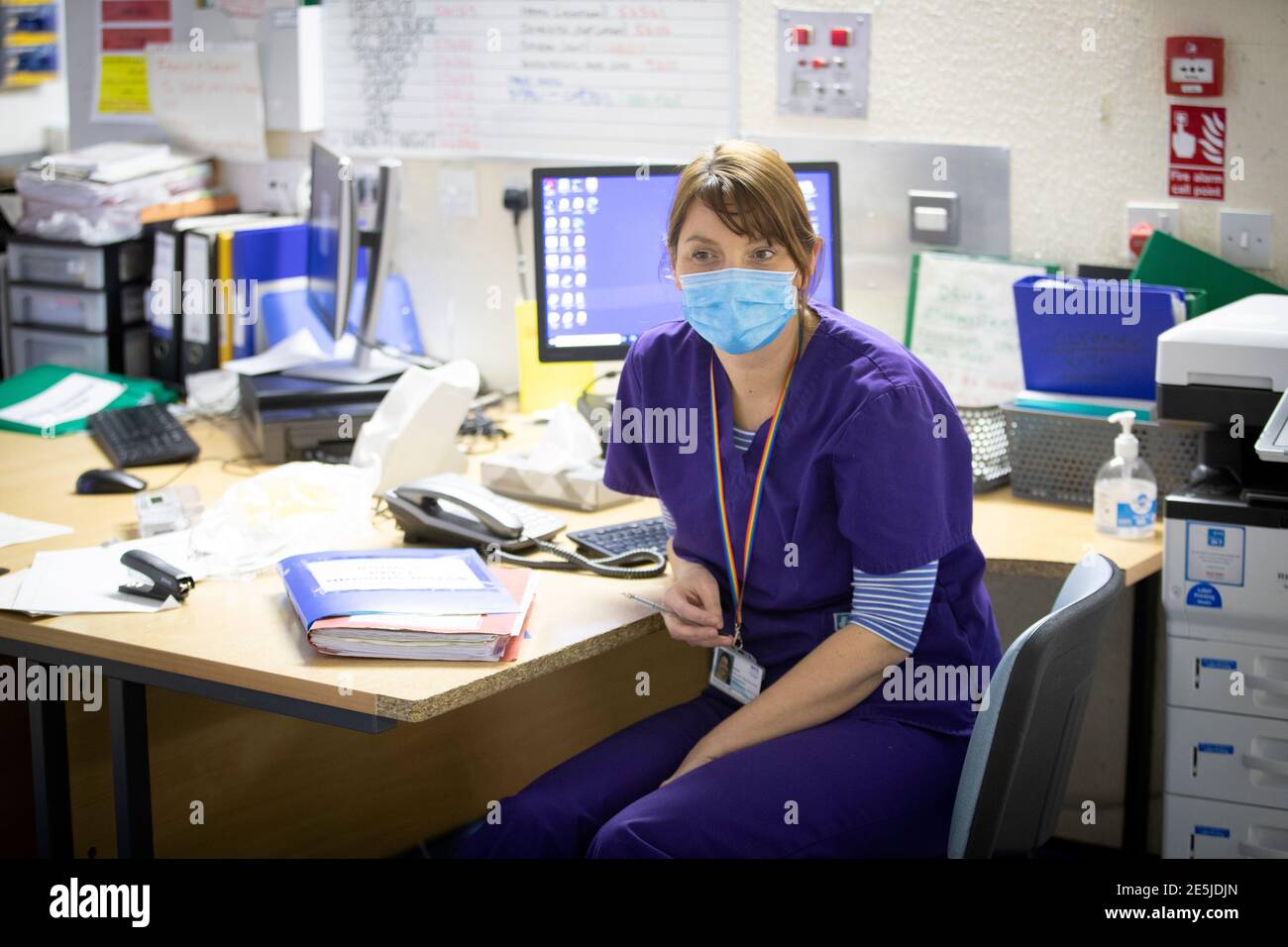 Dr Lucy McCracken working at her desk in Ward 5, a Covid Red Ward, at