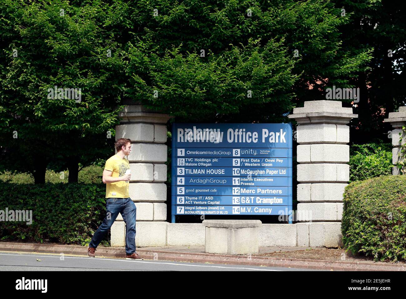 A man walks past the Richview Office Park which houses Western Union  offices in Dublin July 8, 2013. Occupying a single floor of a three-storey  building in a suburban Dublin office park,