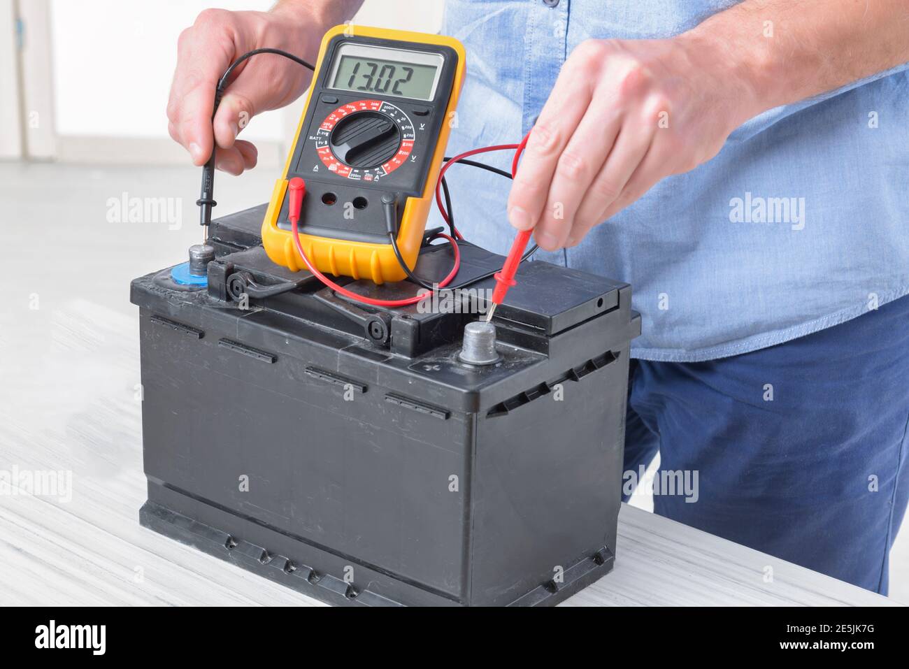 Testing car battery with digital multimeter Stock Photo - Alamy