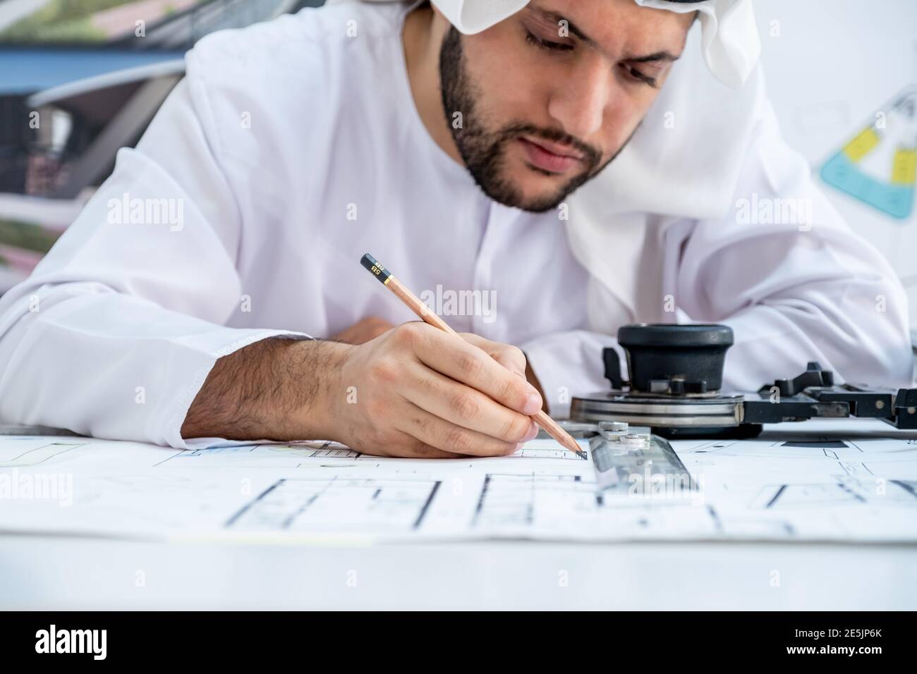 Focused arab architect working on a new project Stock Photo